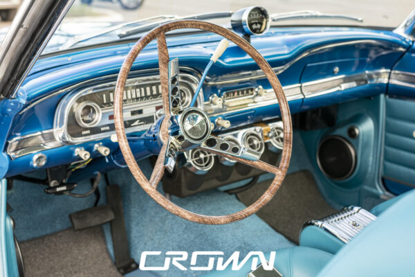 Interior dashboard and walnut steering wheel of a restored 1963 Ford Falcon Sprint