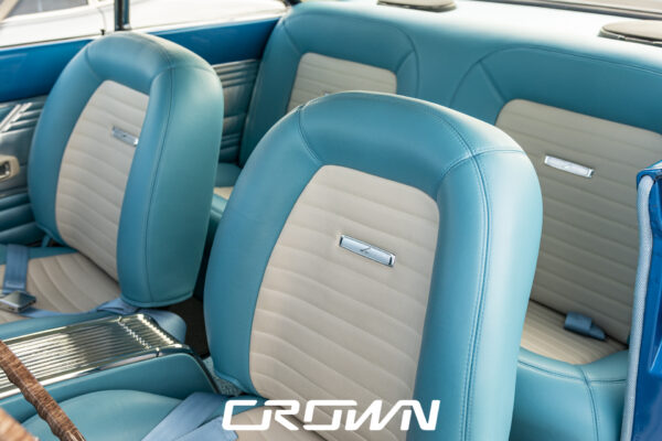 Two-tone blue and white interior seats of a restored 1963 Ford Falcon Sprint