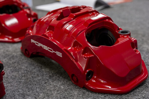 red powder coated Porsche brake caliper