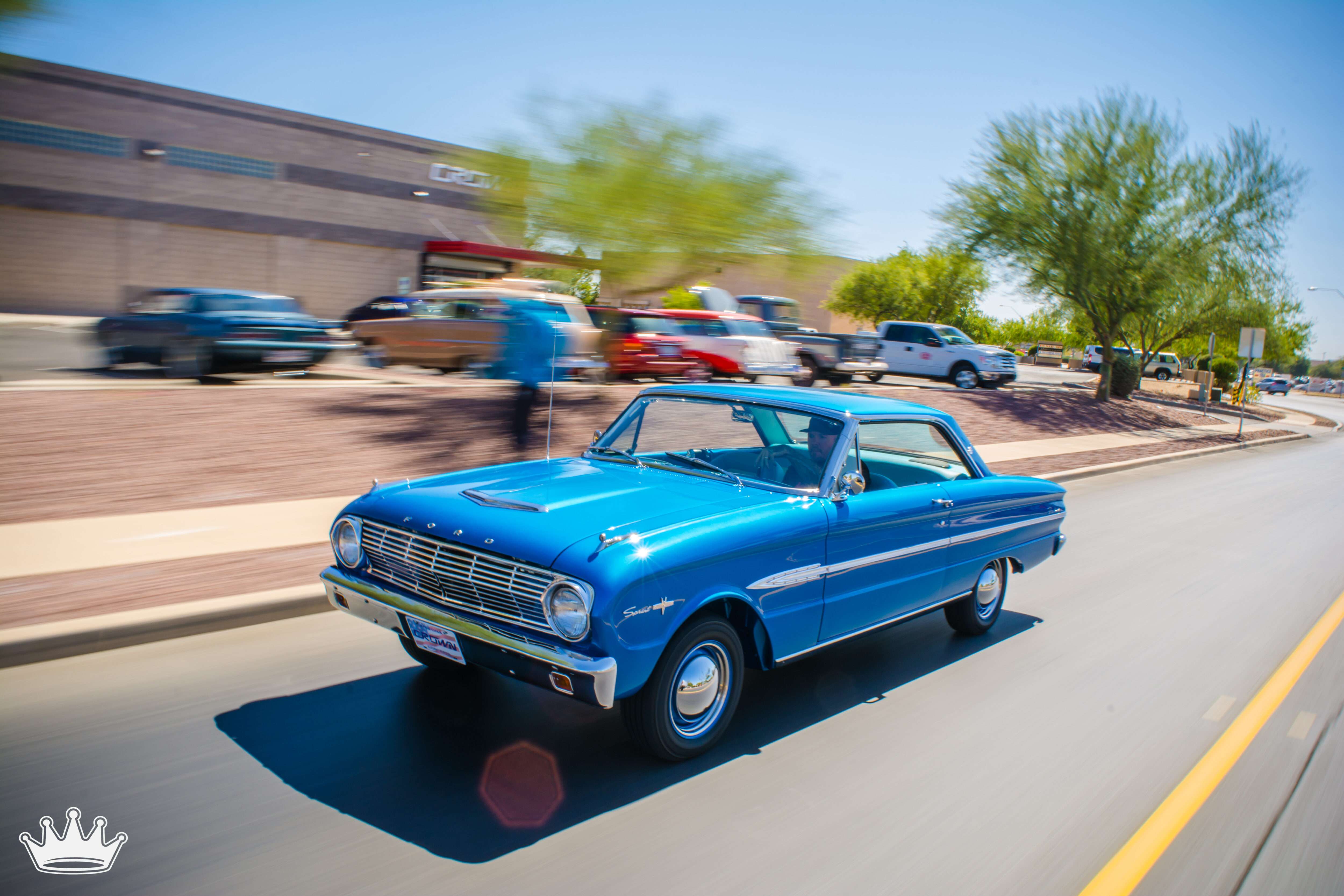 Blue 1963 Ford Falcon Sprint restored driving down Costco Drive in Tucson arizona