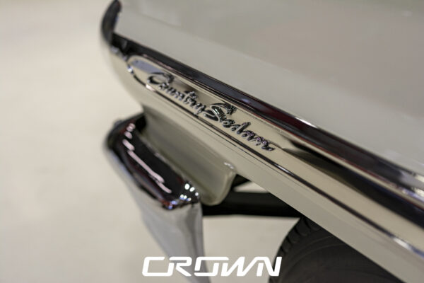 Country Sedan script badge and chrome tailgate trim on a 1964 Ford station wagon