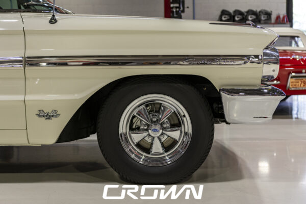 Side profile of a 1964 Ford Country Sedan wagon showing Cragar mag-style wheels
