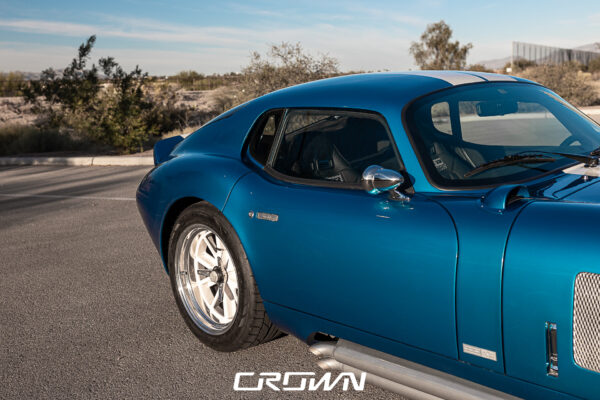 Close-up of the steering wheel and gauges in a Shelby Daytona Coupe, chassis CSX9170, blue with white stripes