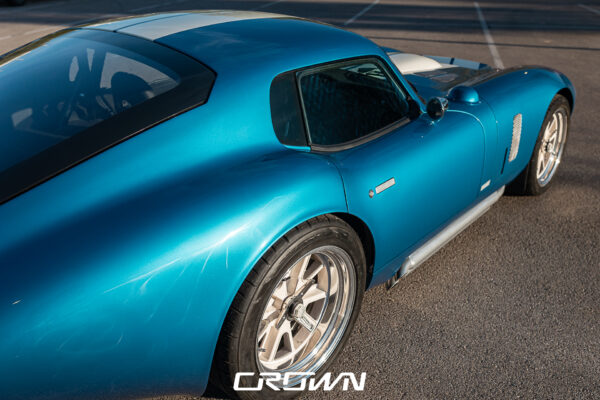 Exterior body line detail on a Shelby Daytona Coupe, chassis CSX9170, blue with white stripes