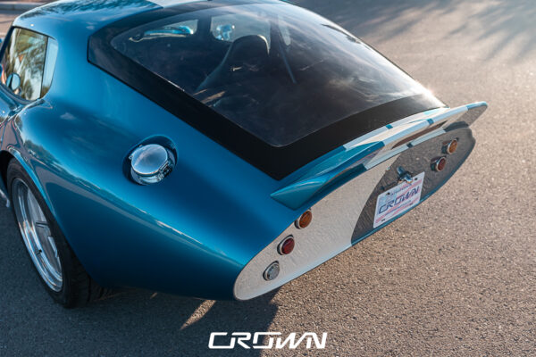 Front three-quarter view of a Shelby Daytona Coupe, chassis CSX9170, blue with white stripes at Crown Customs in Tucson