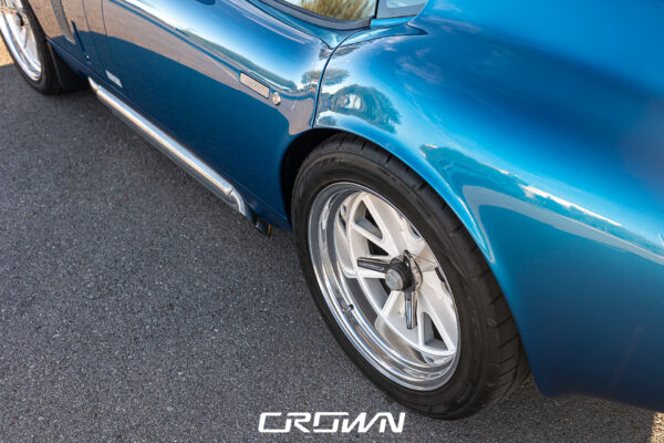 Rear three-quarter view of a Shelby Daytona Coupe, chassis CSX9170, blue with white stripes