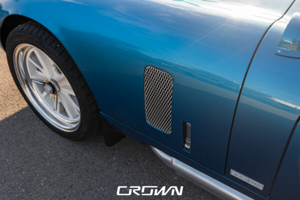 Front grille and headlight detail on a Shelby Daytona Coupe, chassis CSX9170, blue with white stripes