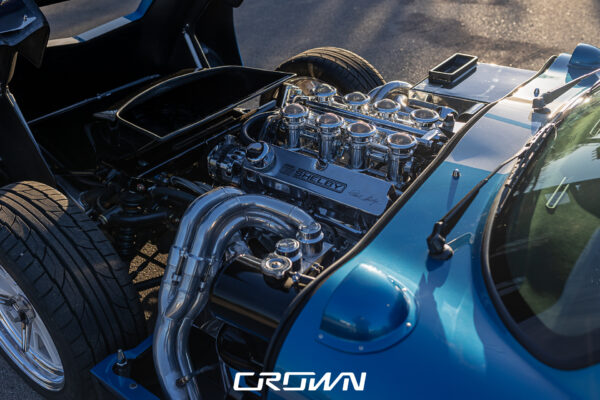 Front three-quarter view of a Shelby Daytona Coupe, chassis CSX9170, blue with white stripes at Crown Customs in Tucson