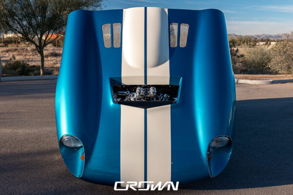 Front grille and headlight detail on a Shelby Daytona Coupe, chassis CSX9170, blue with white stripes