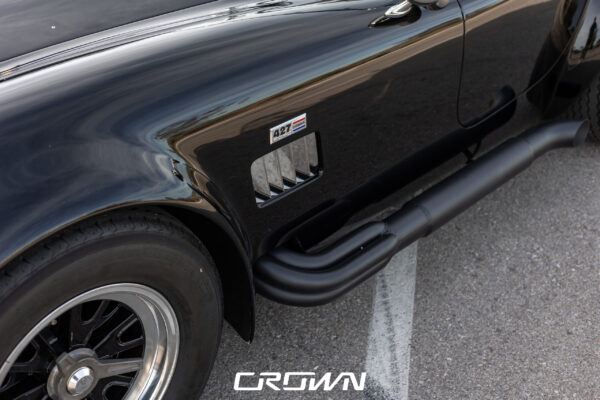 Rear three-quarter view of a Superformance MKIII Cobra, chassis SP03627, solid black