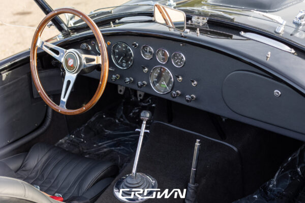 Engine bay detail on a Superformance MKIII Cobra, chassis SP03627, solid black after drivetrain install by Crown Customs