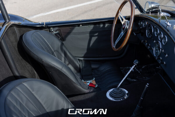 Interior seat and dashboard detail in a Superformance MKIII Cobra, chassis SP03627, solid black