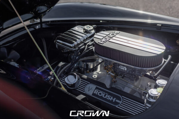 Detail shot of a Superformance MKIII Cobra, chassis SP03627, solid black, at Crown Customs