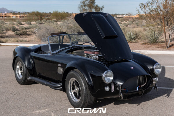 Front grille and headlight detail on a Superformance MKIII Cobra, chassis SP03627, solid black