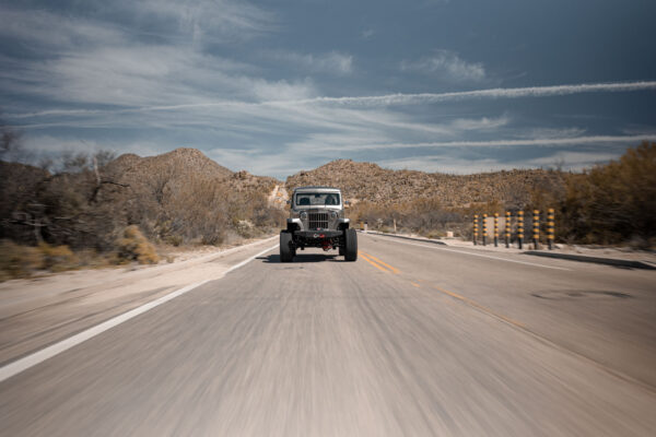 Custom 1961 Willys Jeep Pickup restomod built by Crown Customs in Tucson, Arizona, with restored bodywork, custom interior, 4x4 upgrades, and modern electronics.