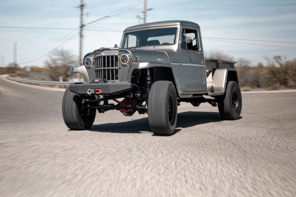 Custom 1961 Willys Jeep Pickup restomod built by Crown Customs in Tucson, Arizona, with restored bodywork, custom interior, 4x4 upgrades, and modern electronics.