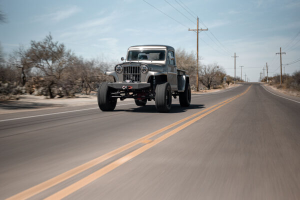 Custom 1961 Willys Jeep Pickup restomod built by Crown Customs in Tucson, Arizona, with restored bodywork, custom interior, 4x4 upgrades, and modern electronics.