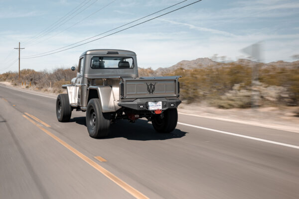 Custom 1961 Willys Jeep Pickup restomod built by Crown Customs in Tucson, Arizona, with restored bodywork, custom interior, 4x4 upgrades, and modern electronics.