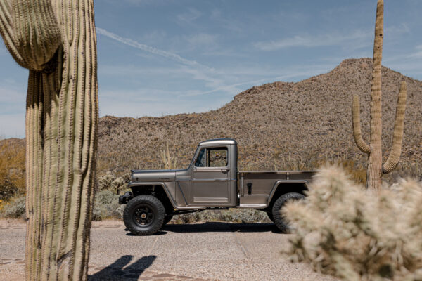 Custom 1961 Willys Jeep Pickup restomod built by Crown Customs in Tucson, Arizona, with restored bodywork, custom interior, 4x4 upgrades, and modern electronics.