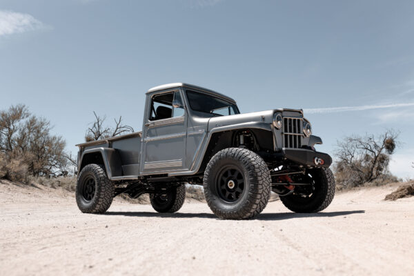 Custom 1961 Willys Jeep Pickup restomod built by Crown Customs in Tucson, Arizona, with restored bodywork, custom interior, 4x4 upgrades, and modern electronics.