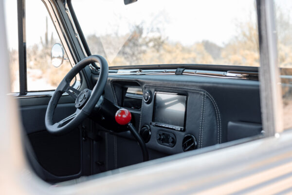 Custom 1961 Willys Jeep Pickup restomod built by Crown Customs in Tucson, Arizona, with restored bodywork, custom interior, 4x4 upgrades, and modern electronics.