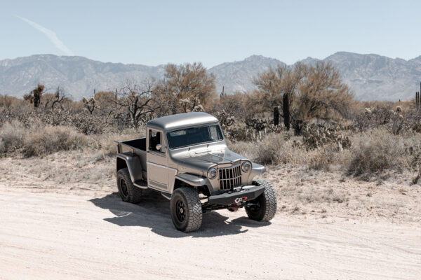 Custom 1961 Willys Jeep Pickup restomod built by Crown Customs in Tucson, Arizona, with restored bodywork, custom interior, 4x4 upgrades, and modern electronics.