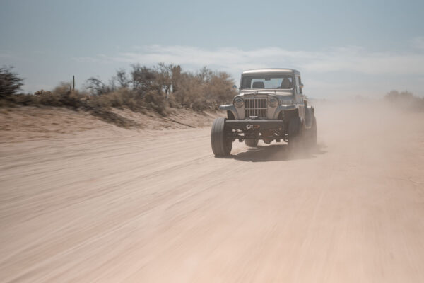 Custom 1961 Willys Jeep Pickup restomod built by Crown Customs in Tucson, Arizona, with restored bodywork, custom interior, 4x4 upgrades, and modern electronics.