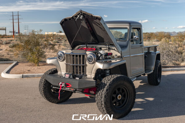 Custom 1961 Willys Jeep Pickup restomod built by Crown Customs in Tucson, Arizona, with restored bodywork, custom interior, 4x4 upgrades, and modern electronics.