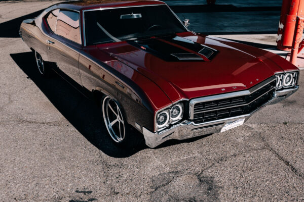 Custom 1969 Buick GS400 restomod built by Crown Customs in Tucson, Arizona, with LS376/480 power, 4L70-E automatic transmission, Forgeline wheels, black stripes, and custom interior work.
