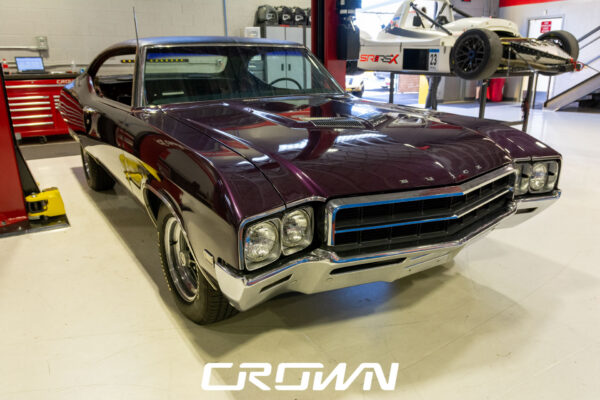 Custom 1969 Buick GS400 restomod built by Crown Customs in Tucson, Arizona, with LS376/480 power, 4L70-E automatic transmission, Forgeline wheels, black stripes, and custom interior work.