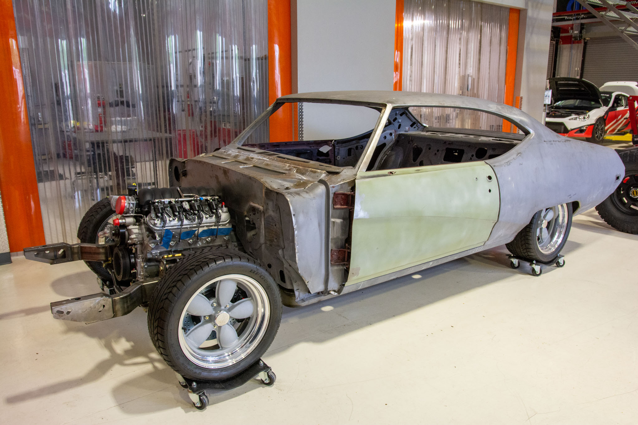 Custom 1969 Buick GS400 driver restomod by Crown Customs Custom 1969 Buick GS400 restomod built by Crown Customs in Tucson, Arizona, with LS376/480 power, 4L70-E automatic transmission, Forgeline wheels, black stripes, and custom interior work.