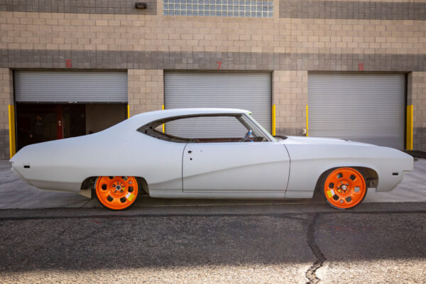 Custom 1969 Buick GS400 restomod built by Crown Customs in Tucson, Arizona, with LS376/480 power, 4L70-E automatic transmission, Forgeline wheels, black stripes, and custom interior work.