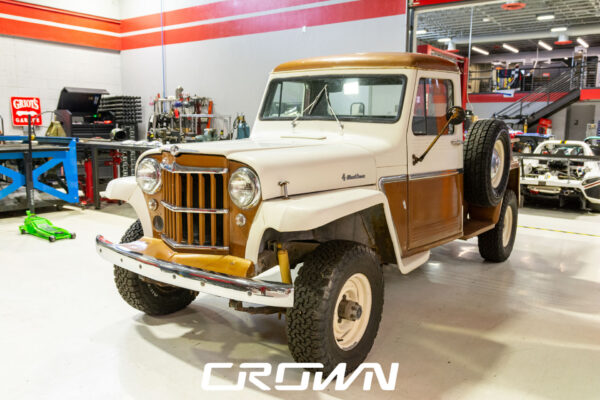 Custom 1961 Willys Jeep Pickup restomod built by Crown Customs in Tucson, Arizona, with restored bodywork, custom interior, 4x4 upgrades, and modern electronics.