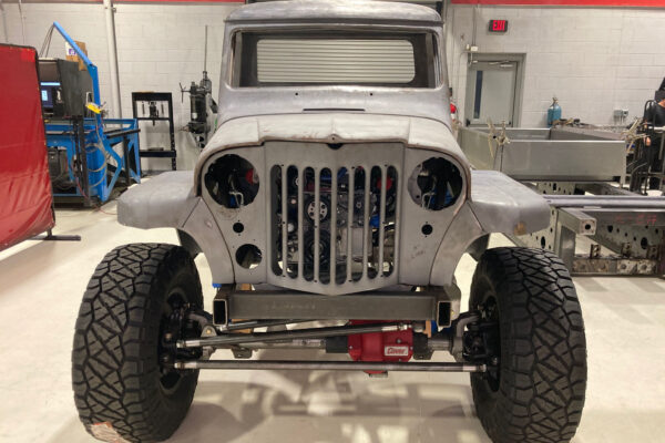 Custom 1961 Willys Jeep Pickup restomod built by Crown Customs in Tucson, Arizona, with restored bodywork, custom interior, 4x4 upgrades, and modern electronics.