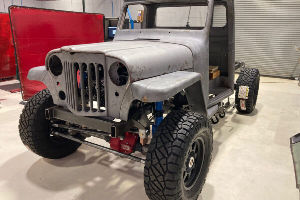 Custom 1961 Willys Jeep Pickup restomod built by Crown Customs in Tucson, Arizona, with restored bodywork, custom interior, 4x4 upgrades, and modern electronics.