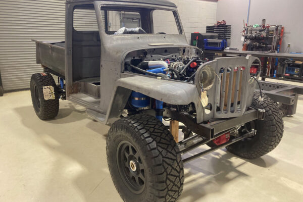 Custom 1961 Willys Jeep Pickup restomod built by Crown Customs in Tucson, Arizona, with restored bodywork, custom interior, 4x4 upgrades, and modern electronics.