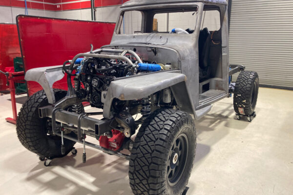 Custom 1961 Willys Jeep Pickup restomod built by Crown Customs in Tucson, Arizona, with restored bodywork, custom interior, 4x4 upgrades, and modern electronics.