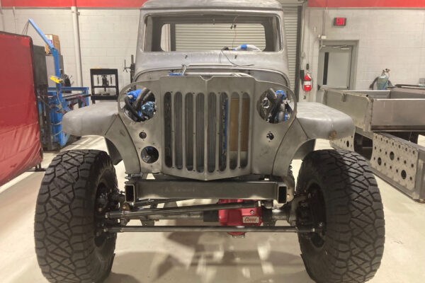 Custom 1961 Willys Jeep Pickup restomod built by Crown Customs in Tucson, Arizona, with restored bodywork, custom interior, 4x4 upgrades, and modern electronics.