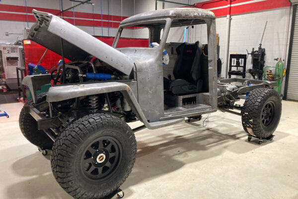 Custom 1961 Willys Jeep Pickup restomod built by Crown Customs in Tucson, Arizona, with restored bodywork, custom interior, 4x4 upgrades, and modern electronics.