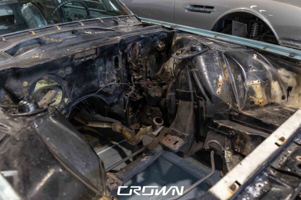 Rusted firewall and engine bay of a 1966 Ford Thunderbird before repair at Crown Customs