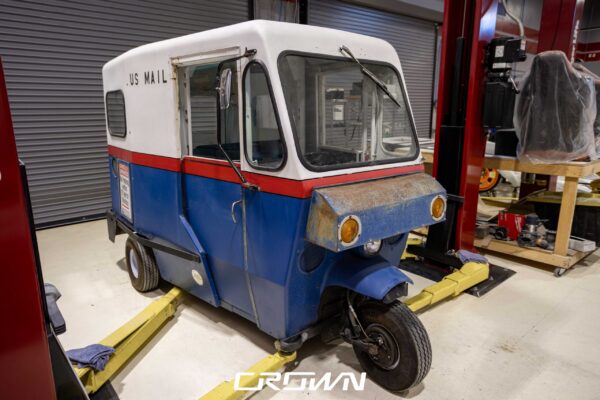 1964 Rand Mailster three-wheeled postal delivery vehicle, front view at Crown Customs in Tucson, Arizona
