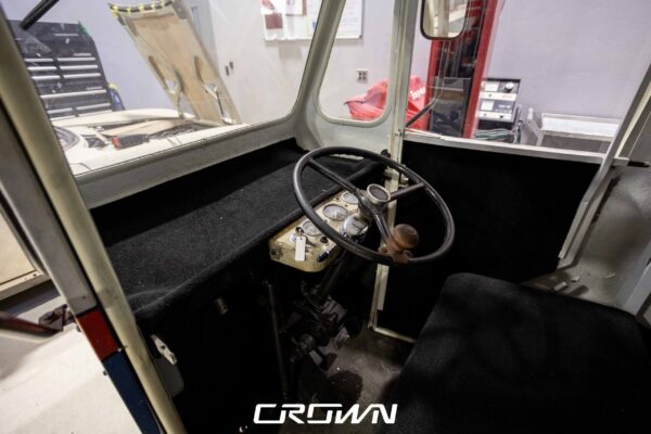 Cab interior of a 1964 Rand Mailster showing the steering wheel and dashboard during restoration