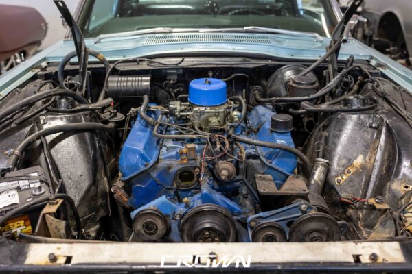 427 FE engine reinstalled in a 1966 Ford Thunderbird with fresh mint green paint on the fenders