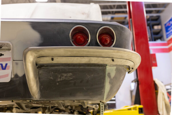 Rear bumper and taillight detail on a 1963 Corvette Sting Ray in primer