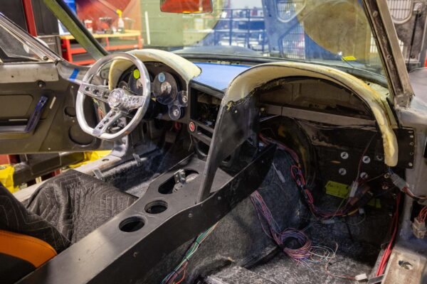 Interior dashboard and roll cage during assembly of a 1963 Corvette Sting Ray restomod