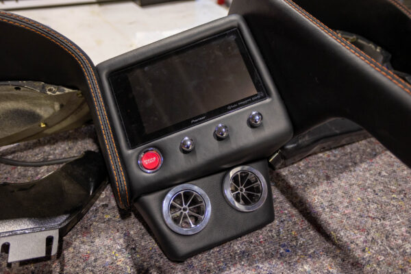 Finished interior center console with digital display and climate controls in a 1963 Corvette Sting Ray restomod