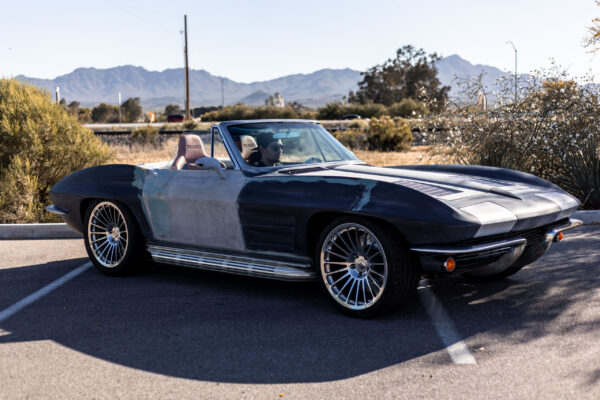 Finished 1963 Corvette Sting Ray parked outdoors with Tucson mountains in the background
