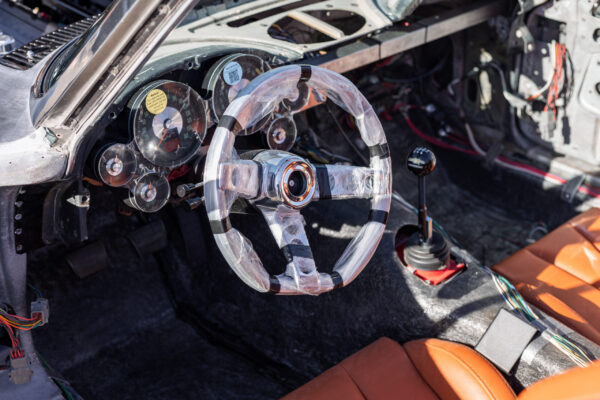Finished interior of a 1963 Corvette Sting Ray restomod, steering wheel and column shifter detail