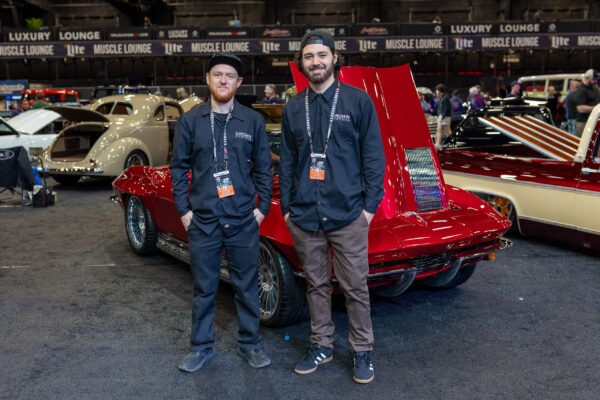 Crown Customs team members with the finished 1963 Corvette Sting Ray at the Barrett-Jackson auction