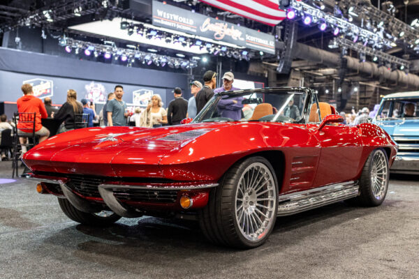 Finished 1963 Corvette Sting Ray restomod on the show floor at Barrett-Jackson, front three-quarter view